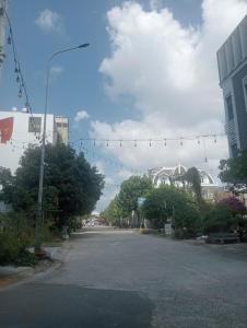 an empty street with christmas lights in a city at Quyenhomestay in Cù Lao Tâu