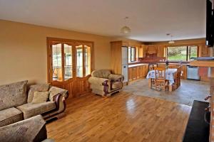 a living room with a couch and a table at 4 Bed in Inch oc-i190 in Anascaul