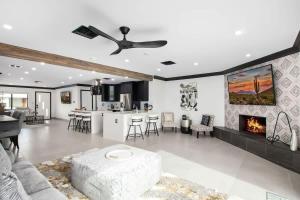 a living room with a couch and a fireplace at Modern Roose-Private Pool-In Old Town Scottsdale in Scottsdale