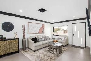 a living room with a couch and a table at Modern Roose-Private Pool-In Old Town Scottsdale in Scottsdale