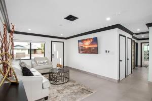 a living room with a white couch and a table at Modern Roose-Private Pool-In Old Town Scottsdale in Scottsdale +63 photos