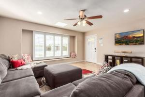 a living room with two couches and a ceiling fan at Games Galore - Old Town Scottsdale - Pool & Golf in Scottsdale +51 photos