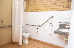 a bathroom with a toilet and a sink at Farview Tavern in Farleigh