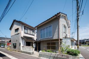 a house on the side of a street at kobito in Toyama