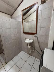 a bathroom with a sink and a mirror at Mama Cat's Accommodation in Avarua +31 photos