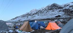 a group of tents on a snowy mountain at The Kedar Stay in Kedārnāth