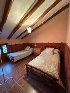 a bedroom with two beds in a room at Casa Castillo in Moratalla