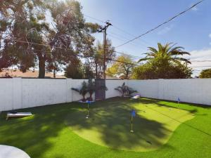 a yard with a fence with golf balls on it at Sweet Serenity-Private Pool-8 Mins to Old Town in Scottsdale
