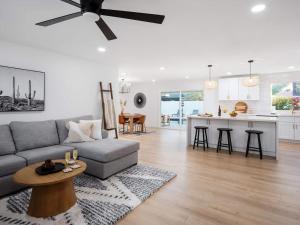 a living room and kitchen with a couch and a table at Sweet Serenity-Private Pool-8 Mins to Old Town in Scottsdale +57 photos