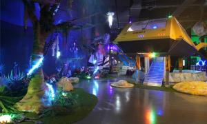 a room with a stage with trees and lights at Belle Fore Resort in Jeungpyeong