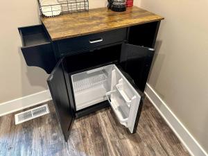 a black cabinet with an open drawer in a room at Harbor Hideaway Suite - River Rock Inn in Bellevue +14 photos