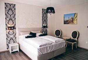 Postel nebo postele na pokoji v ubytování Hotel Bakarni Lonac