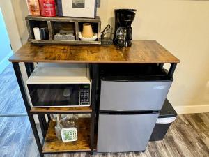 a table with a counter with a microwave on it at Paddle Wheel Suite-Potter’s Mill in Bellevue +31 photos