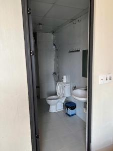 a bathroom with a toilet and a sink at Ngan Nga in Bắc Hà