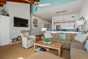 a living room with a couch and a table at Solana Beach Resort in Solana Beach