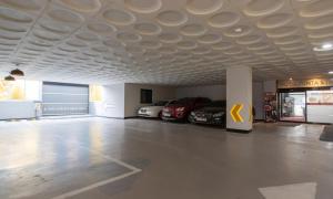 a parking lot with cars parked in a garage at Incheon Pentastar Hotel in Incheon