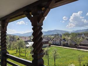 a view from a window of a village at Carpathian Soul Maramures in Bogdan Vodă