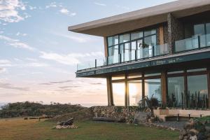 a large building with glass windows on a hill at Lemeraude BnB in Hengchun South Gate