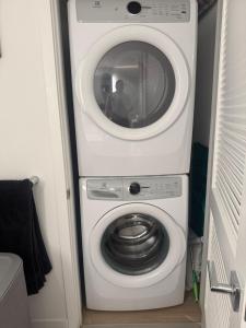 a washer and dryer in a small room at Luxury Loft 1BR Steps Away from Santa Monica Pier in Los Angeles