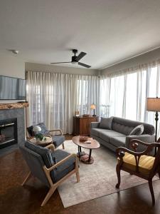 a living room with a couch and a fireplace at Our Mountain View in Tucson