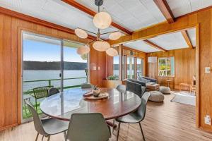 a dining room with a table and chairs at Oyster Oasis in Tahuya