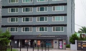 a tall building with a sign for a hotel at Incheon Wolmido Stellamaris Hotel in Incheon