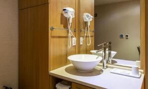 a bathroom with a bowl sink and a mirror at Incheon Wolmido Stellamaris Hotel in Incheon +35 photos