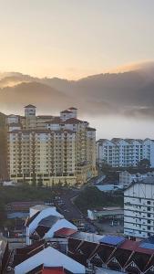 a view of a city with tall buildings at Centrum Homstay at Crown Imperial Court in Cameron Highlands