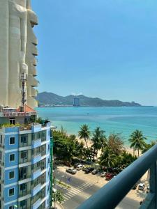 a view of a hotel and the ocean from a balcony at Ocean Dream Apartment Nha Trang in Nha Trang