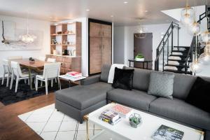 a living room with a couch and a table at Halcyon, a hotel in Cherry Creek, Denver in Denver
