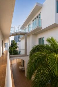 an external view of a building with a balcony at Coral Princess Hotel in San Juan