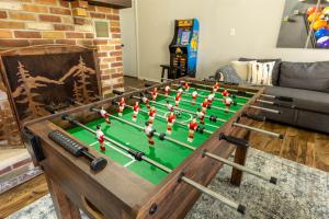 a large pool table with balls on it in a living room at Pickleball Pool Table Hot Tub FirePit King Bed in Blakeslee +41 photos
