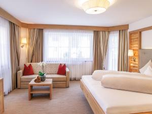Posteľ alebo postele v izbe v ubytovaní Salnerhof Superior Lifestyle Resort