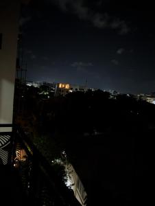 a view of a city at night at Modern Luxury 2BR Spacious Cozy 24hr Power in Lekki