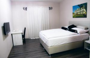 Postel nebo postele na pokoji v ubytování Hotel Bakarni Lonac