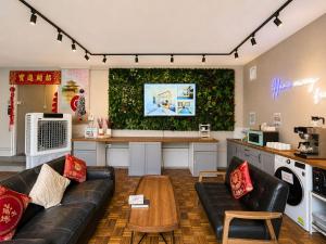 a living room with a couch and a table at K2 Guesthouse in Singapore