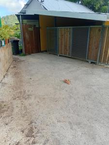 a dirt yard in front of a building at Tereva home 1 in Bora Bora +2 photos