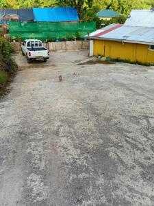 a car parked in a parking lot next to a building at Tereva home 1 in Bora Bora