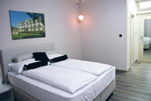 Postel nebo postele na pokoji v ubytování Hotel Bakarni Lonac