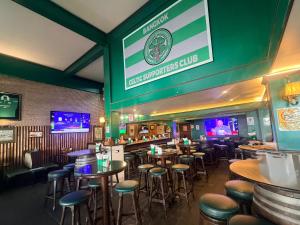 a bar with tables and stools in a restaurant at O'Shea's Sukhumvit Bangkok in Klong Toi +24 photos