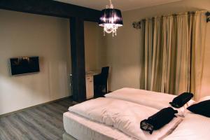 Postel nebo postele na pokoji v ubytování Hotel Bakarni Lonac