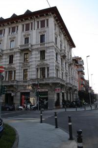 a large white building on a city street at Made in Italy in Bergamo