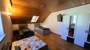 a room with a bed and a couch in a room at Wohnung Maric bis zu 11 Personen in Neunburg vorm Wald