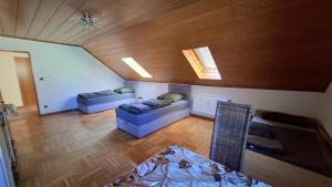 an overhead view of a living room with two couches at Wohnung Maric bis zu 11 Personen in Neunburg vorm Wald