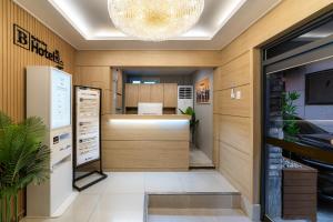 an office with a reception desk and a chandelier at BigBoxStay Myeongdong in Seoul