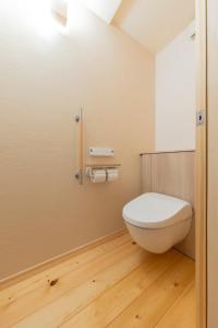 a bathroom with a white toilet in a room at nikko nagomi 和み in Nikko +29 photos