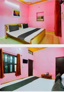 a bedroom with pink walls and a bed at Hotel cozy guest house in Alīgarh