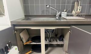 a kitchen with a sink and a counter top at Yeonsan The Stay in Busan +16 photos