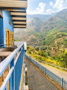 a balcony with a view of the mountains at Athiti Devo Bhava in Chakrāta
