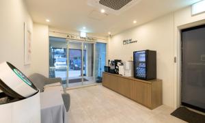 a waiting room at a car dealership with a tv at Cheongju Hotel Dictionary in Cheongju